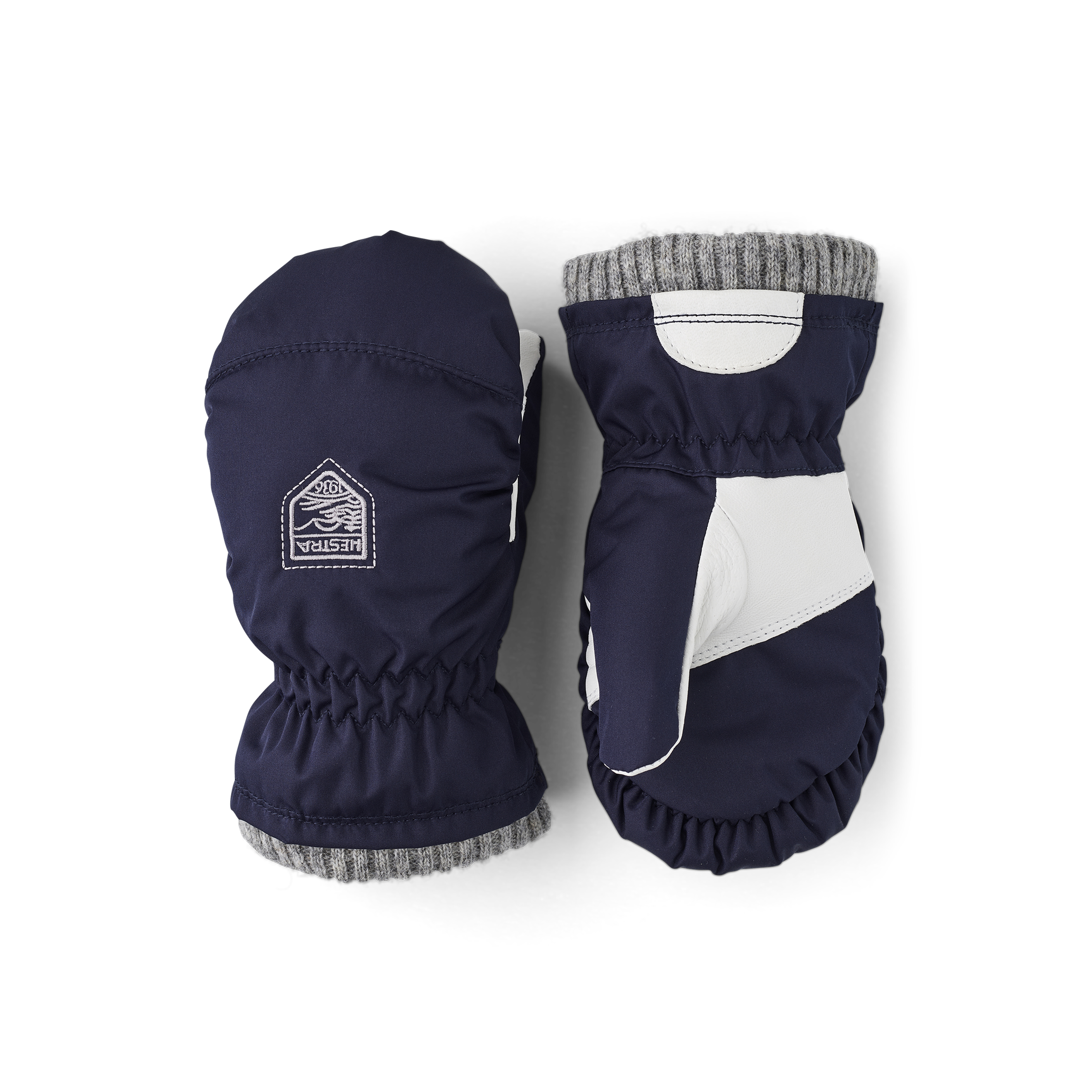 Dunkelblauer Fausthandschuh aus Stoff mit grauem Bündchen und weißer Innenhand aus Haarschafleder