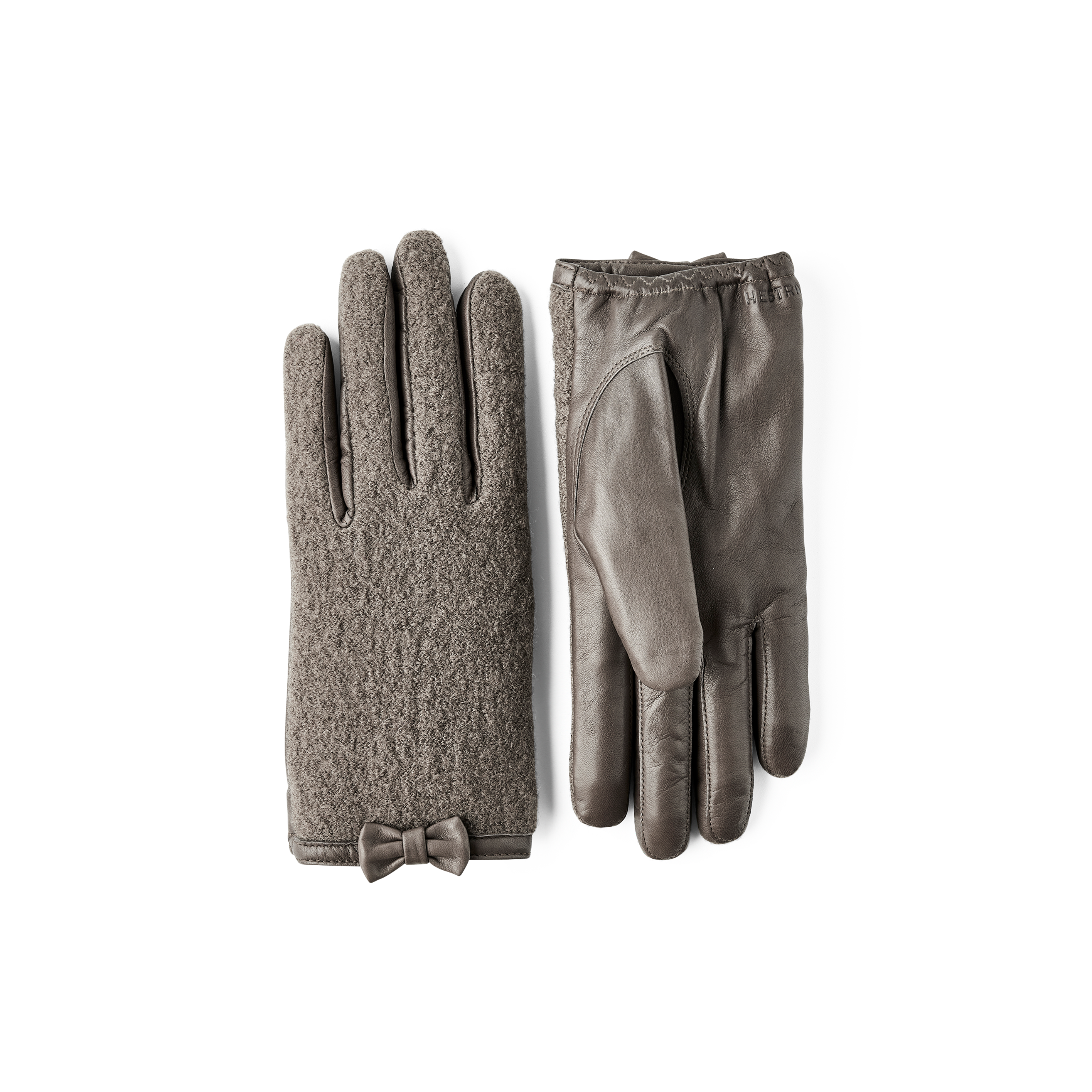 Grüner Lederhandschuh aus Haarschafleder mit Bouclé-Strick auf der Oberhand und kleiner Schleife