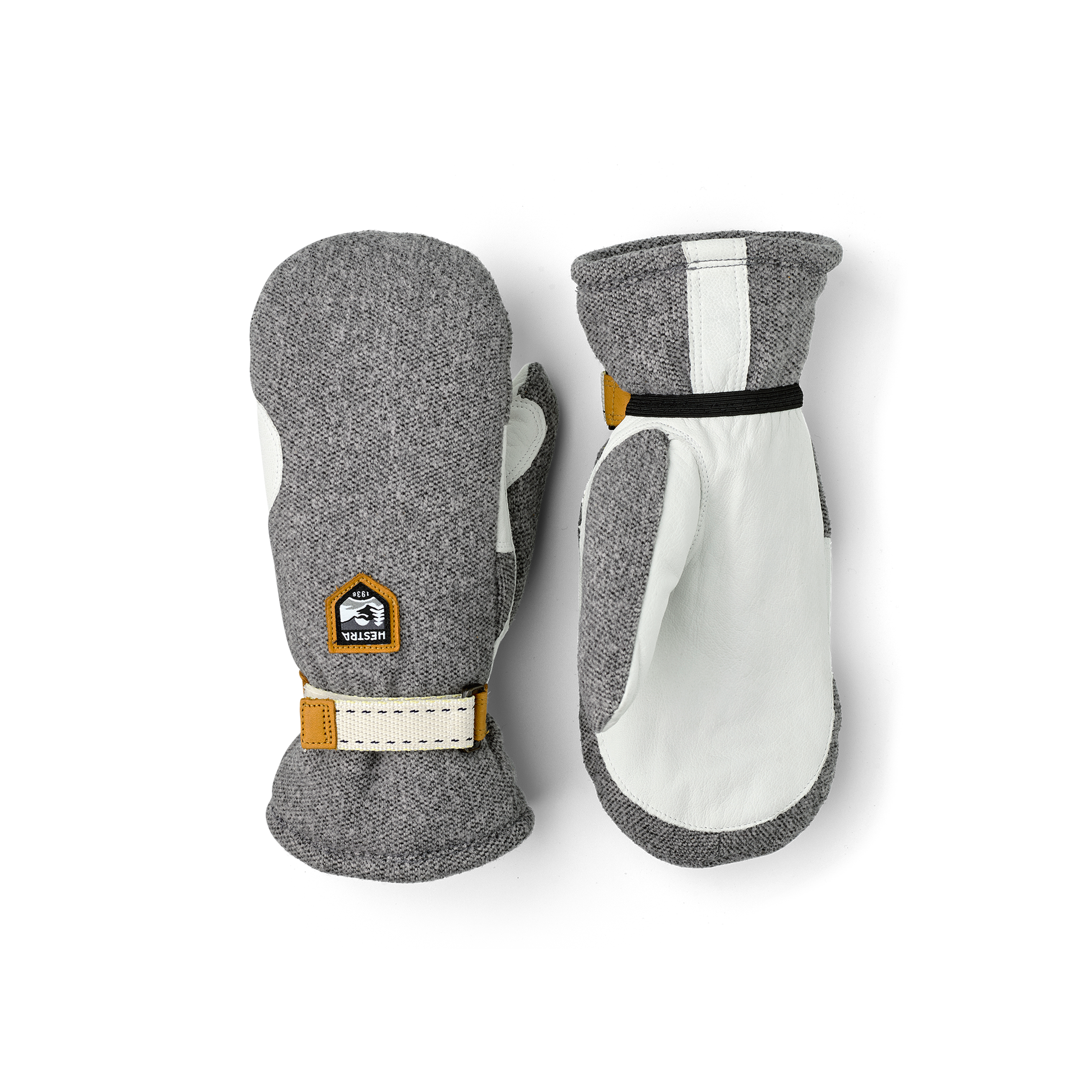 Grauer Fausthandschuh mit weißem Ziegenleder an der Innenhand und verstellbarem Handgelenkverschluss