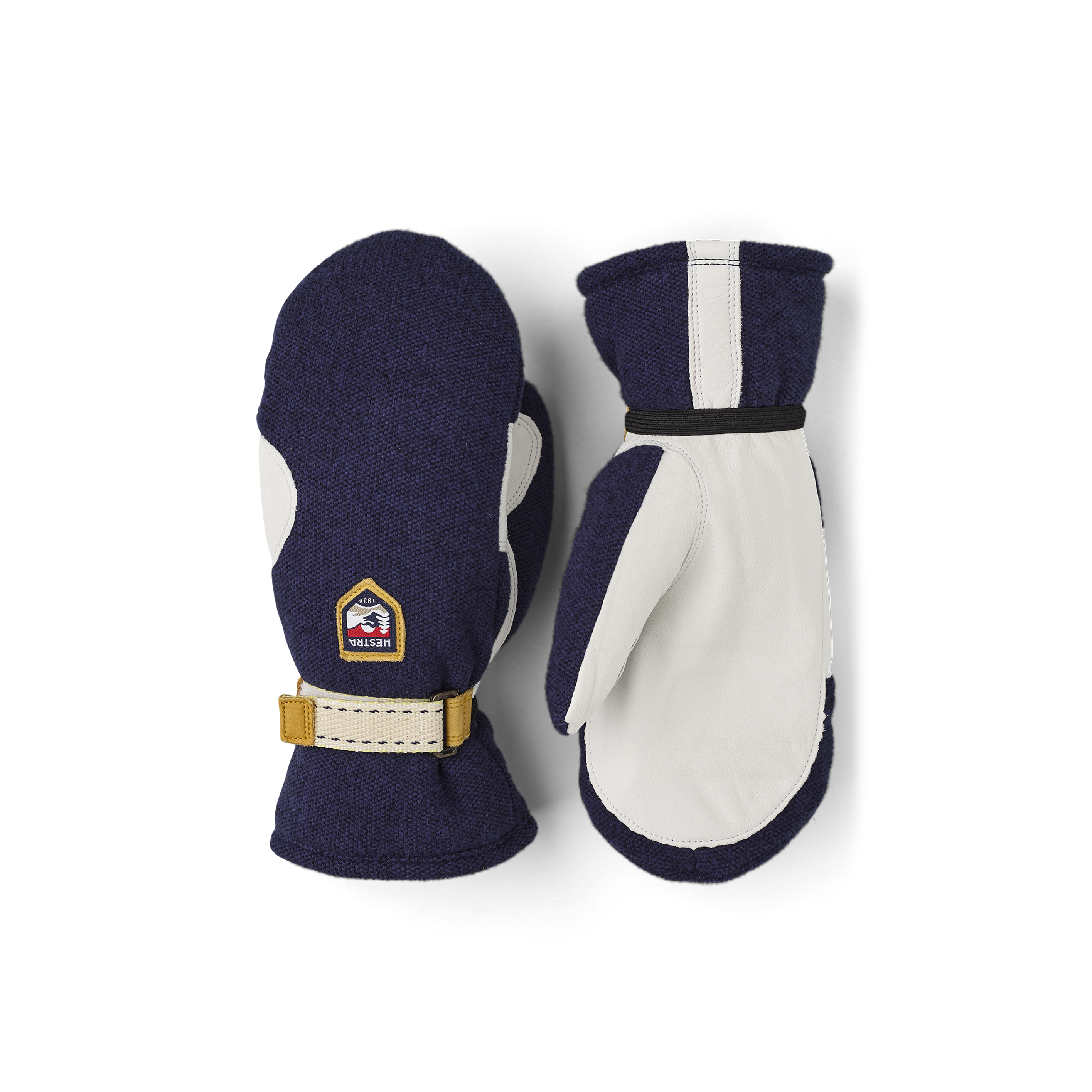 Dunkelblauer Fausthandschuh mit weißem Ziegenleder an der Innenhand und verstellbarem Handgelenkverschluss